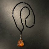 Raw Amber Pendant On Triangular Onyx Beads